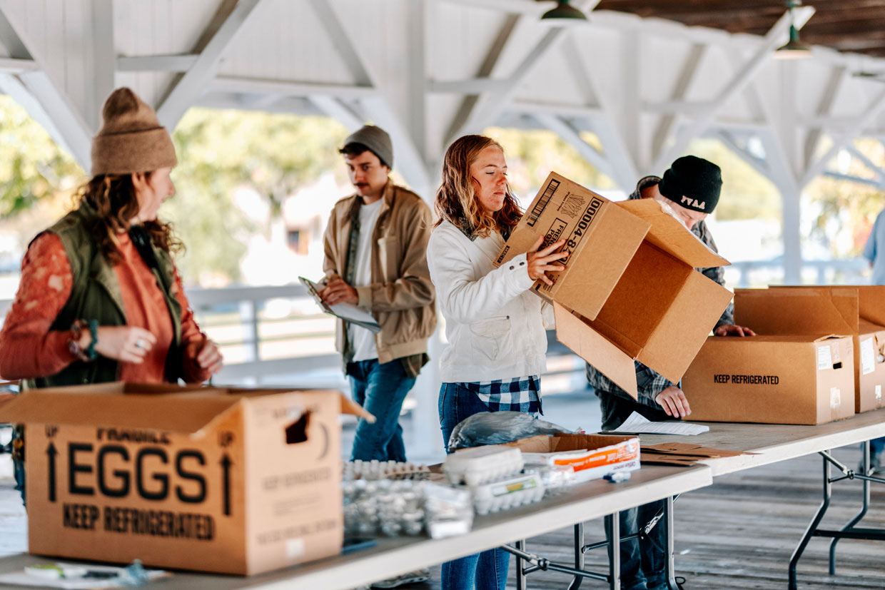 feast down east team packing eggs in winter at the food hub