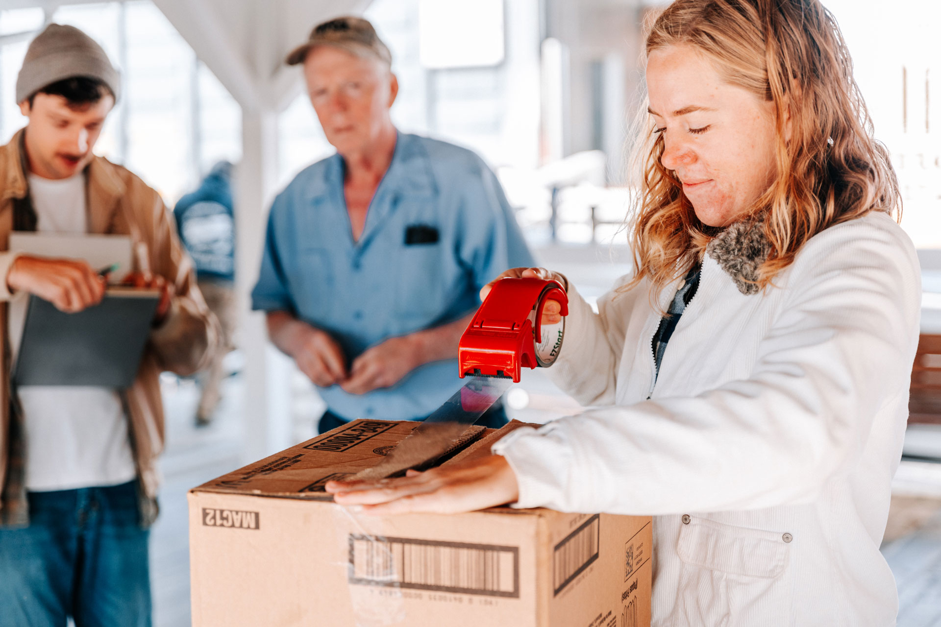 packing up an order at the food with a farmer present